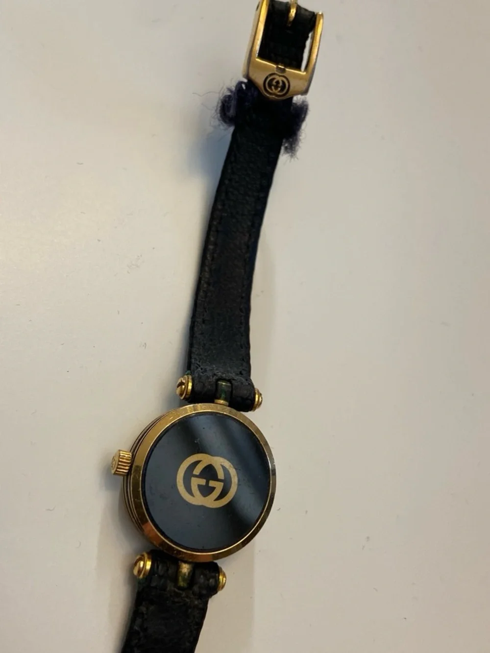 Gucci Black and Gold Round Dial Leather Strap Watch